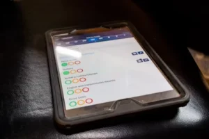 A close-up of a tablet screen displaying the portal balance check for SkillsFuture Credit.